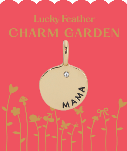 A gold charm with 'mama' inscribed on it, set against a pink background with illustrated plants and the words 'Lucky Feather CHARM GARDEN'.