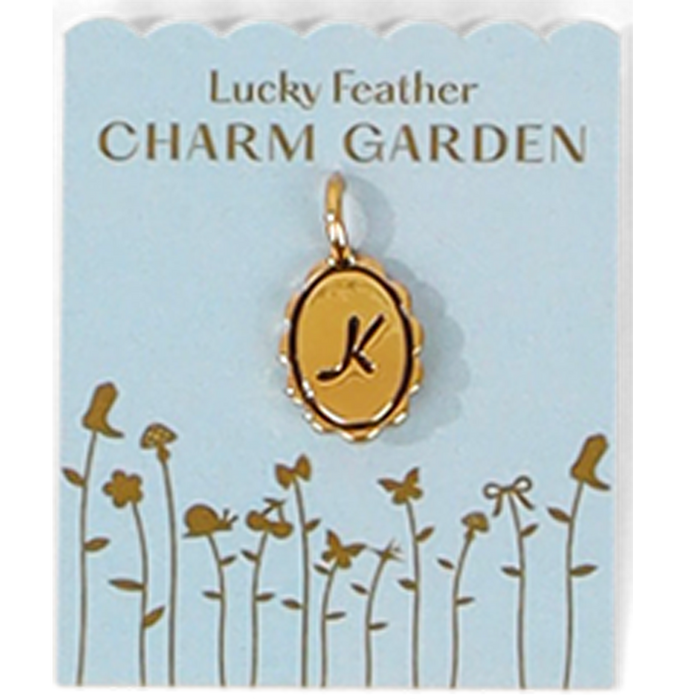 A 'Lucky Feather Charm Garden' card features a gold-colored charm with the letter 'K' and a whimsical flower garden design.