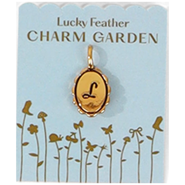 The image shows a 'Lucky Feather Charm Garden' card with an oval gold charm bearing the letter 'L'.