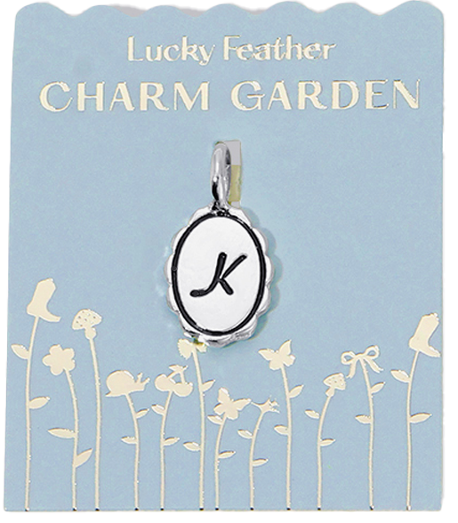 Oval charm pendant with a letter 'K' on a blue card labeled 'Lucky Feather Charm Garden'.