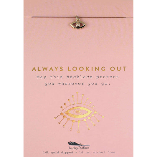 Close-up of a 'Lucky Feather' necklace on a pink card with gold text and graphics.