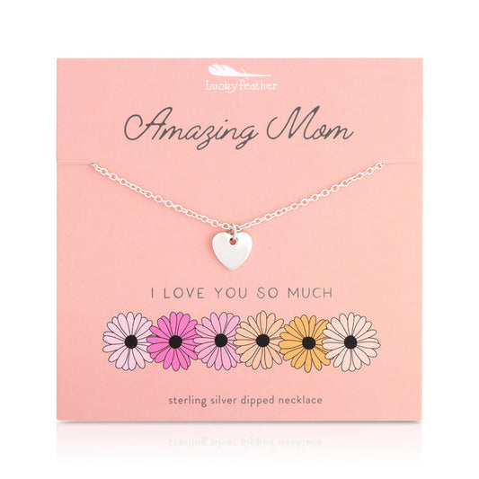 Sterling silver heart necklace displayed on a pink card with floral illustrations.