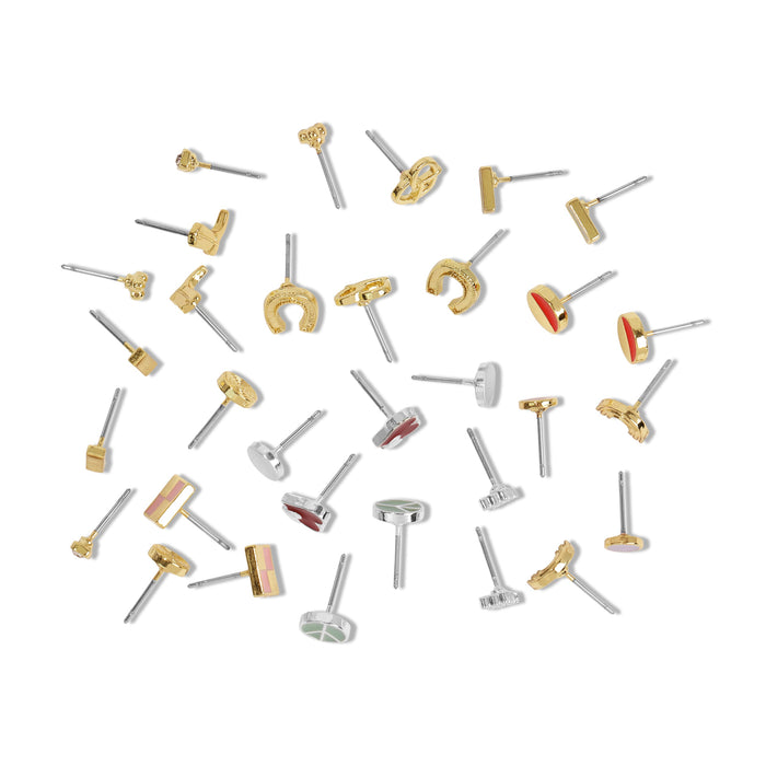 Scattered assortment of stud earrings on a white background.