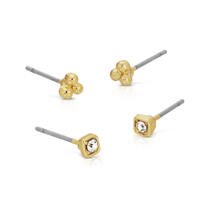 Four single stud earrings, two gold three-ball clusters and two gold squares with a clear gem, sit on a white background.