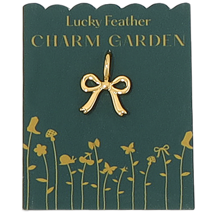 A 'Lucky Feather Charm Garden' card holds a gold bow charm.