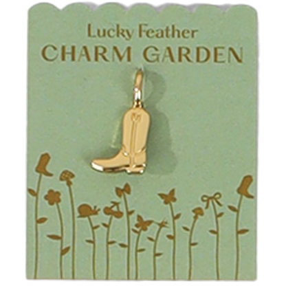 A golden cowboy boot charm hangs on a green card that says 'Lucky Feather CHARM GARDEN'.