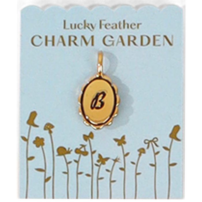 A 'Lucky Feather CHARM GARDEN' display card shows a gold pendant with the letter 'B.'