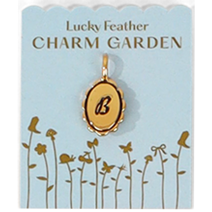 A 'Lucky Feather CHARM GARDEN' display card shows a gold pendant with the letter 'B.'