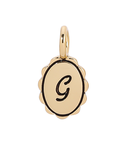 Gold pendant with the letter 'G'.