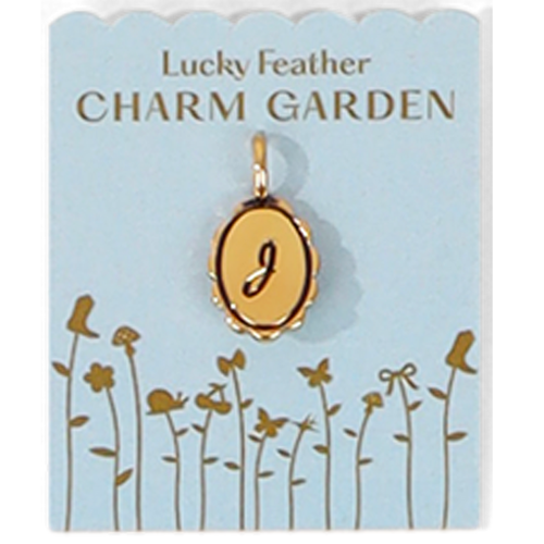 The image shows a gold-colored pendant with the letter 'J' on a light blue 'Lucky Feather CHARM GARDEN' card decorated with floral designs.