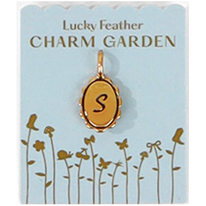 A gold charm pendant of the letter S hangs on a 'Lucky Feather Charm Garden' card.