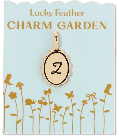 A 'Lucky Feather Charm Garden' tag displays a charm with the letter 'Z' on a light blue background with a garden design.