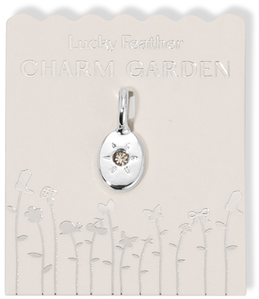 A pendant on a presentation card that reads 'Lucky Feather Charm Garden'.