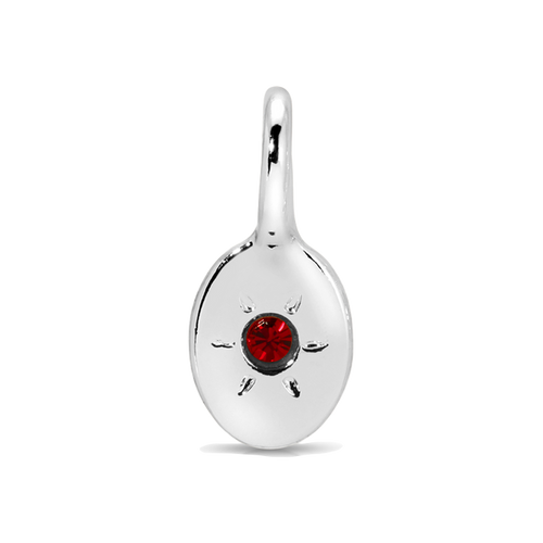 A silver pendant with a red stone in the center.