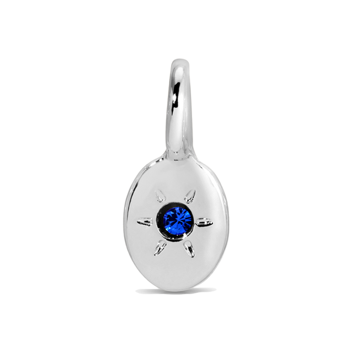 Silver pendant with a blue gemstone.
