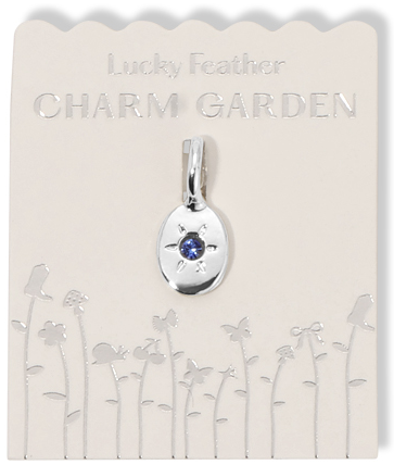 A 'Lucky Feather Charm Garden' pendant is displayed on its card.
