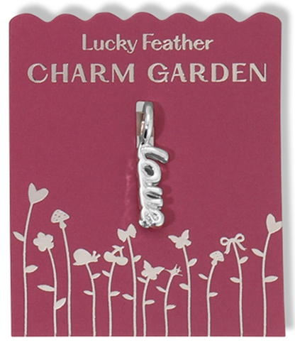 A 'love' charm hangs on a 'Lucky Feather Charm Garden' card.