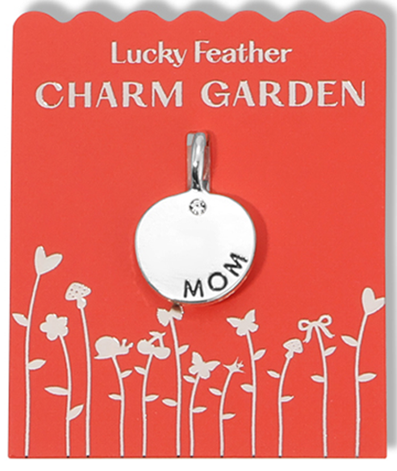 A Lucky Feather Charm Garden pendant that says 'Mom' on a red card.