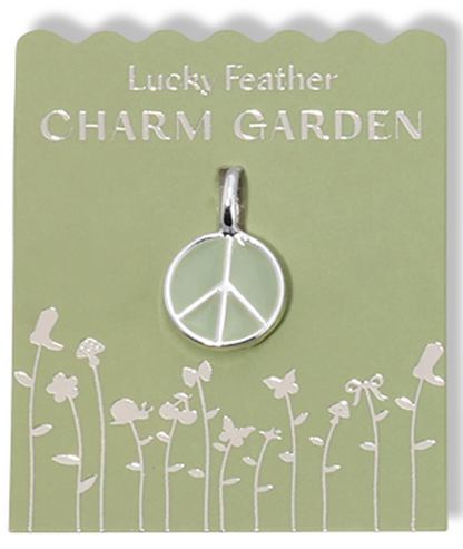 A 'Lucky Feather Charm Garden' package with a peace sign pendant.