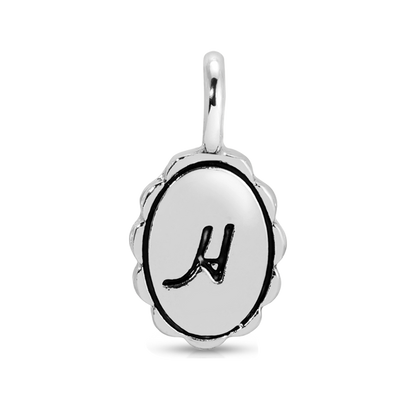 A silver charm with the letter 'H'.