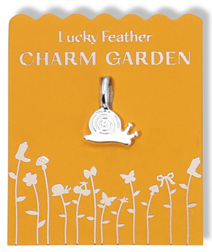 A silver snail charm on a yellow 'Lucky Feather Charm Garden' card with floral graphics.