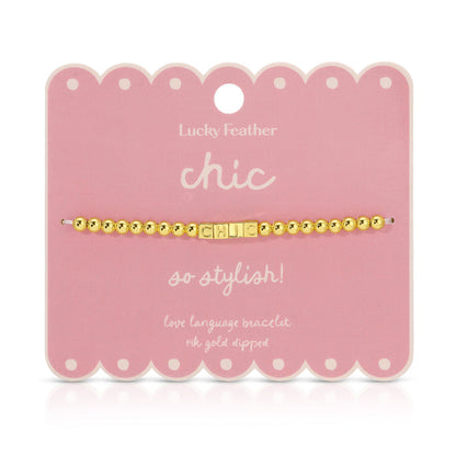A 'Chic' beaded bracelet is displayed on its pink, scalloped product card.