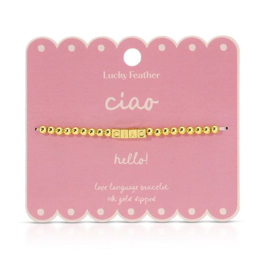 Ciao bracelet made of golden beads and letter beads on a pink card.