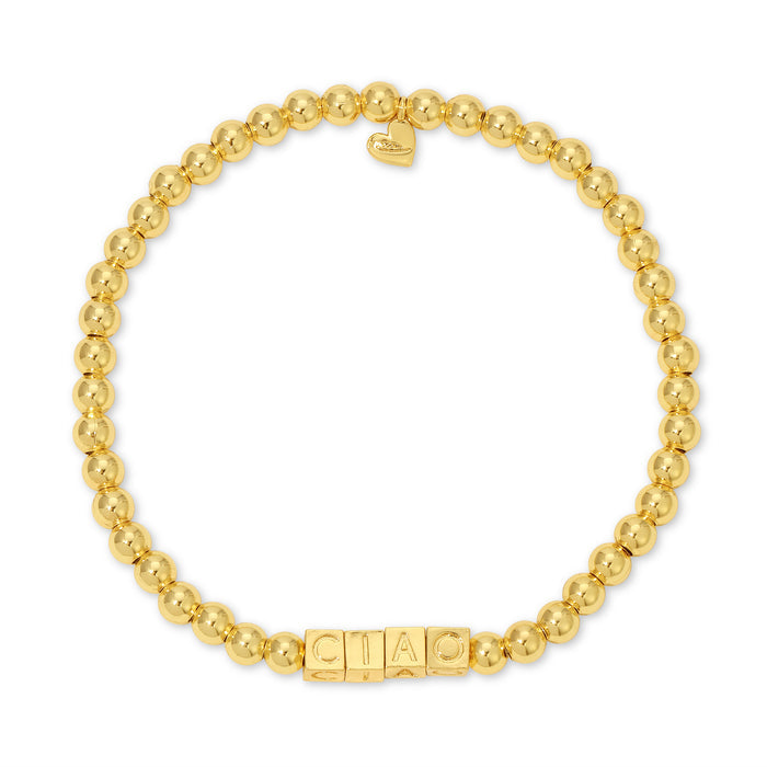 A bracelet made of gold beads and square beads spelling 'CIAO' is displayed against a white background.