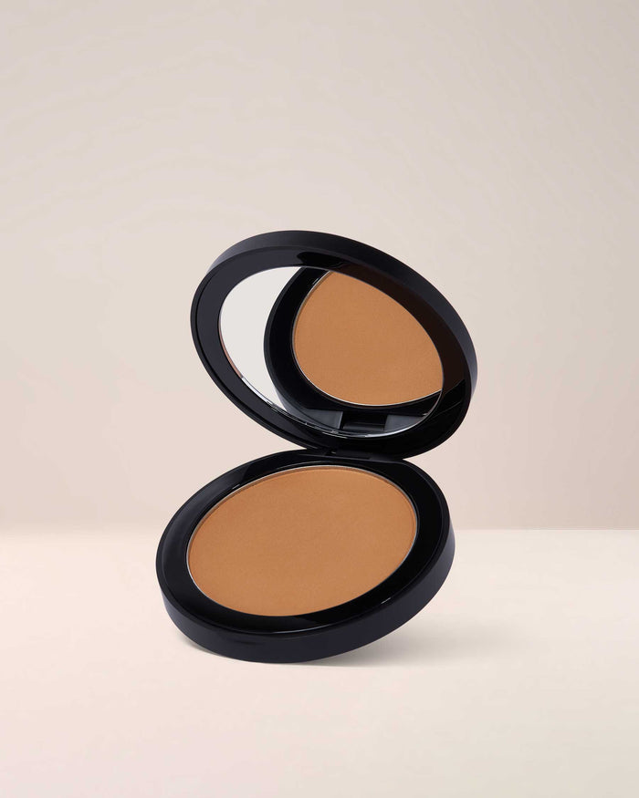 EM Cosmetics Corselette Sculpting Powder Bronzer in Sensual, a medium-deep shade for a warm, sculpted, soft-matte contour.