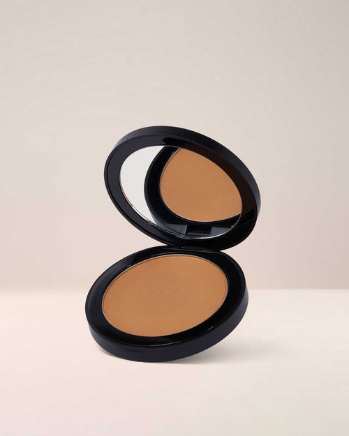 EM Cosmetics Corselette Sculpting Powder Bronzer in Sensual, a medium-deep shade for a warm, sculpted, soft-matte contour.