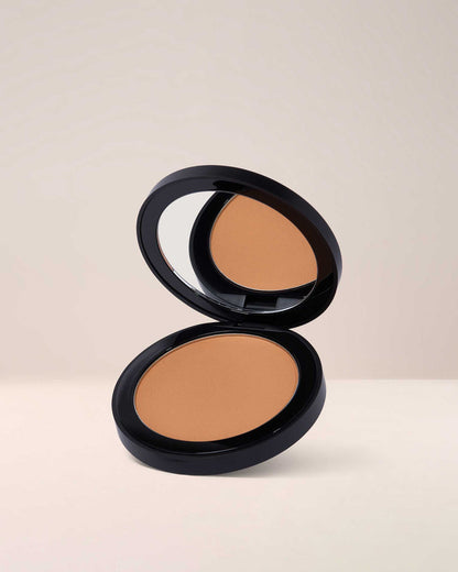EM Cosmetics Corselette Powder Bronzer in Silhouette, a deep shade ideal for contouring and adding soft-matte warmth.