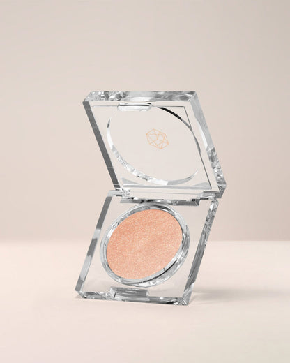 EM Cosmetics Cosmic Pearl Dewy Eyeshadow in Wish, a sparkling peach for a bright, pearlescent, wet-look eye.