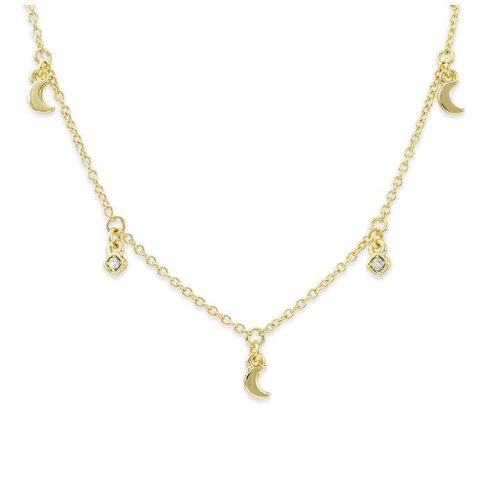 A gold necklace with moon and square charms.