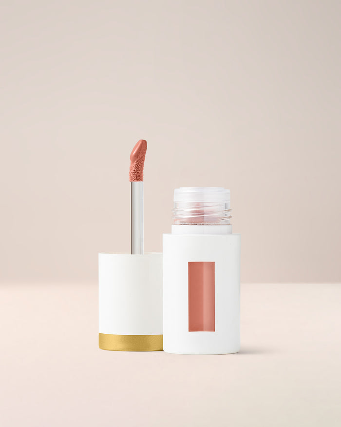 EM Cosmetics Everglass Lip Dew in Enchant, a warm rose, a high-shine lip lacquer for a juicy, vinyl-like pout.