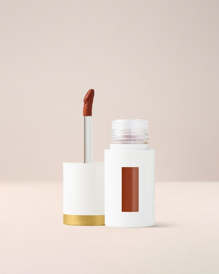 EM Cosmetics Everglass Lip Dew in Secret, a warm toffee nude, a long-wearing lip lacquer with a glassy, vinyl finish.