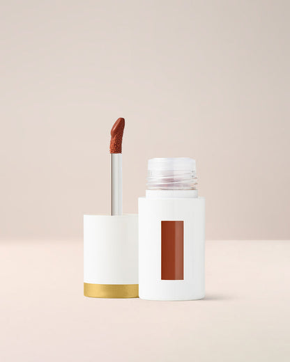 EM Cosmetics Everglass Lip Dew in Secret, a warm toffee nude, a long-wearing lip lacquer with a glassy, vinyl finish.