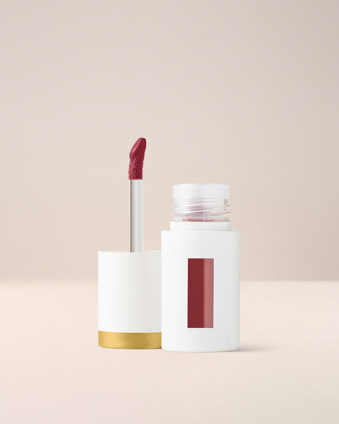 EM Cosmetics Everglass Lip Dew in Temptress, a deep wine shade, a high-pigment gloss for a bold, vinyl-shine lip.