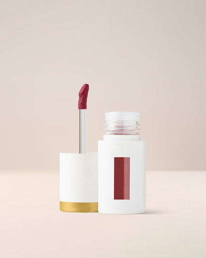 EM Cosmetics Everglass Lip Dew in Temptress, a deep wine shade, a high-pigment gloss for a bold, vinyl-shine lip.