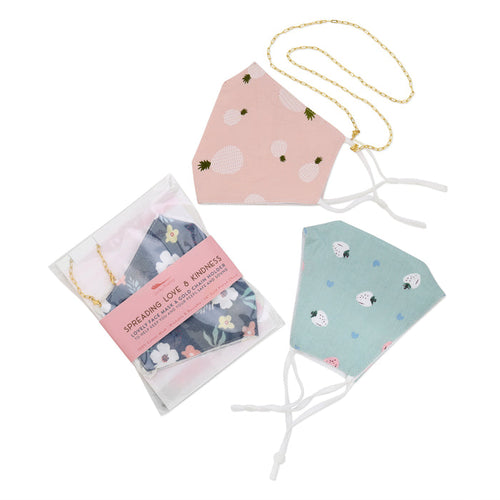 Three cloth face masks, one in packaging with a label.