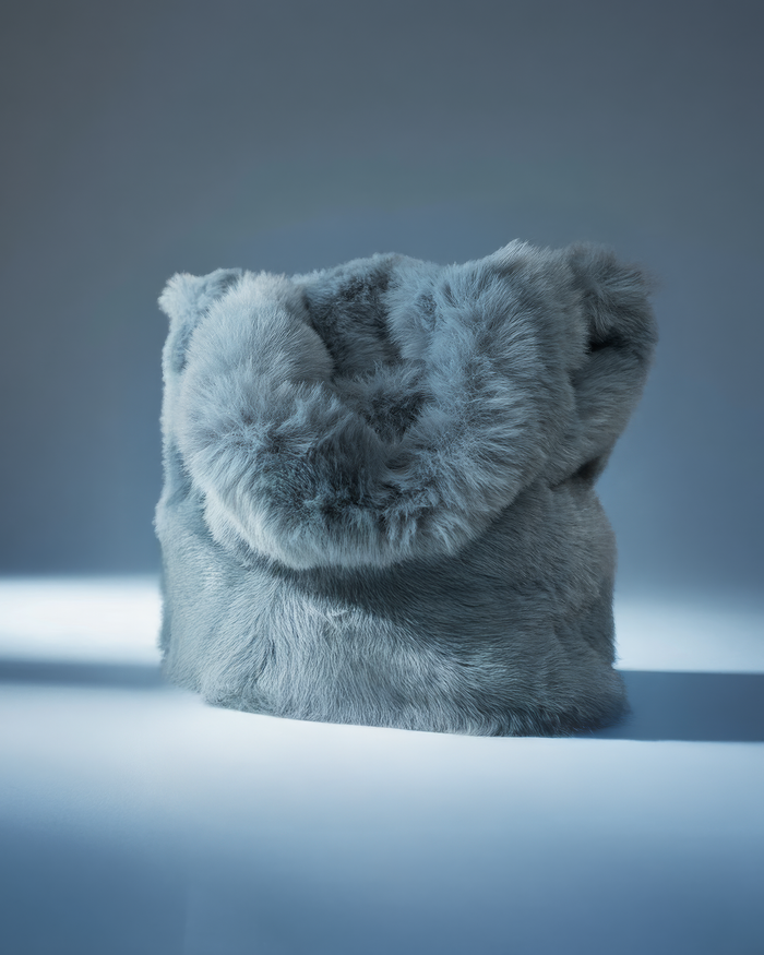 EM Cosmetics Misty Bag in Brown, a plush fuzzy makeup pouch ideal for travel.