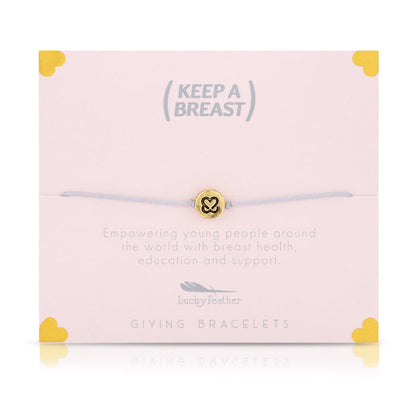 A bracelet with a gold charm sits on a pink card with the text 'Keep A Breast,' along with details on breast health education and support.