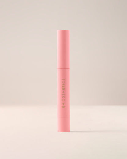 EM Cosmetics Lip Cushion in Angèle shown closed in its modern, minimalist white and clear acrylic packaging.