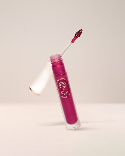 EM Cosmetics Lip Mage Tinted Serum in Charmed, a rosy pink, a comfortable lip stain with a serum-like texture.