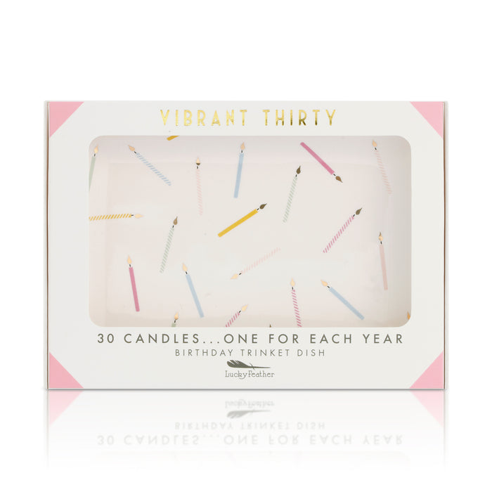 A 'Vibrant Thirty' birthday trinket dish box features a window showing a design of scattered colorful candles.