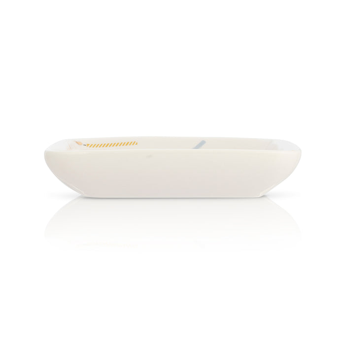 A small, shallow, white rectangular dish with rounded corners is displayed on a white background with a reflection.