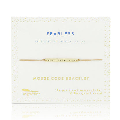 A 'Fearless' morse code bracelet by Lucky Feather is displayed on its packaging.