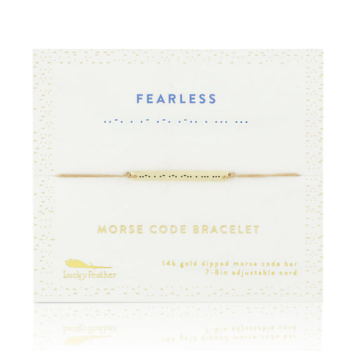 A 'Fearless' morse code bracelet by Lucky Feather is displayed on its packaging.