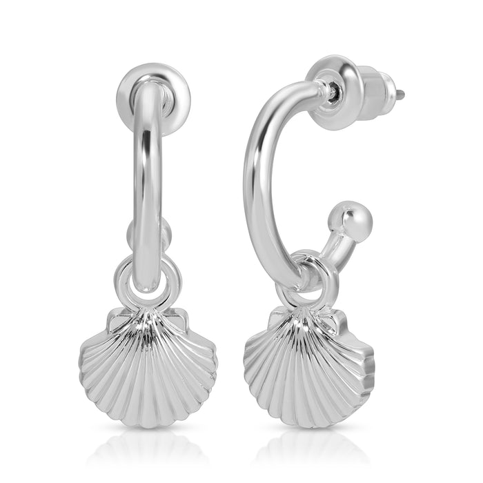 A pair of silver hoop earrings with seashell charms.