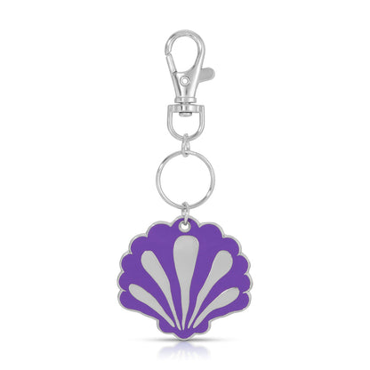 A silver keychain with a purple seashell pendant.