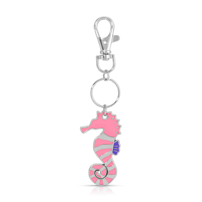 A pink and silver seahorse charm hangs from a silver keyring and clip.